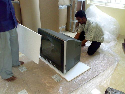 packing TV by a packers and movers
